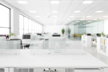 Rearview shot of a young call centre agent working in an office